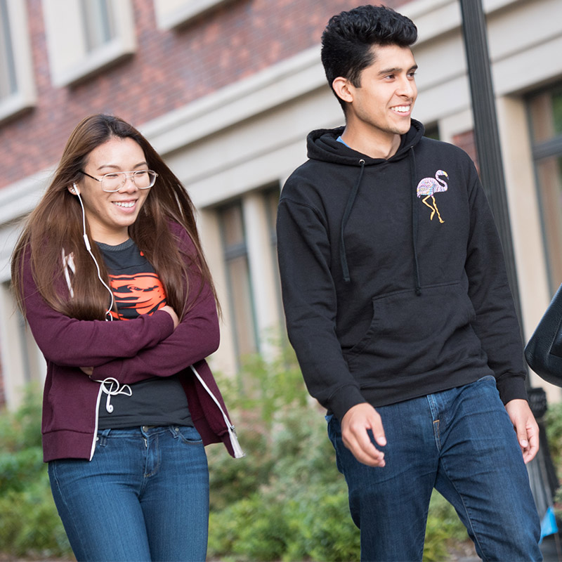 Two Oregon State students walk on the Corvallis campus.